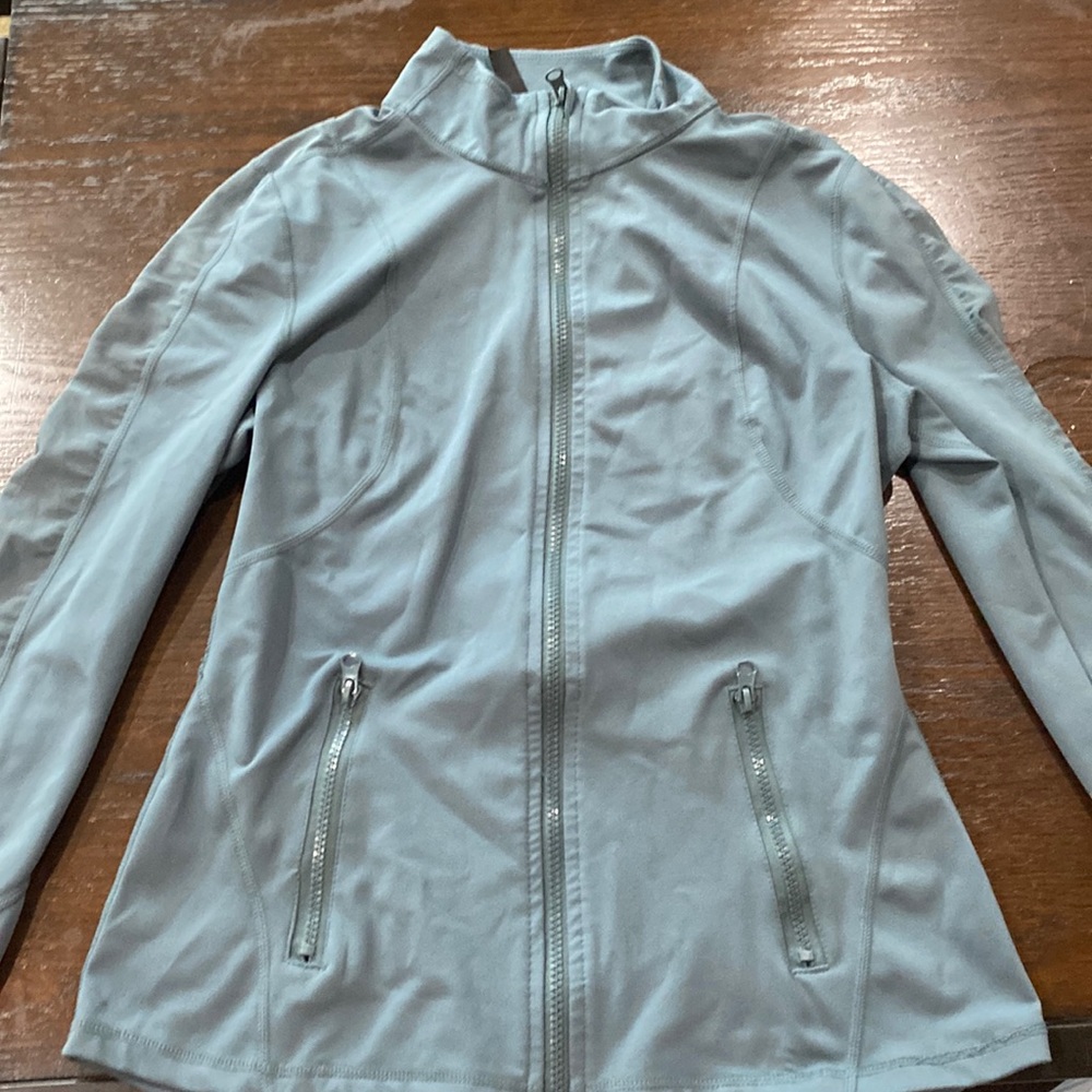 A teal colored sports jacket